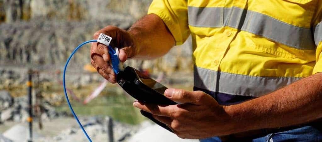 Advanced blasting supports sustainable mining 2 A BME technician prepares the AXXIS electronic detonator - ensuring precise, data-driven blasting that enhances safety, fragmentation, and environmental control.